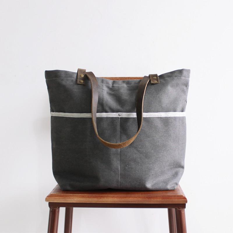 Black waxed canvas tote bag / office bag with luggage handle attachment  leather handles and shoulder